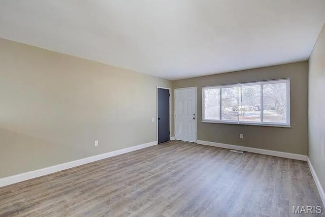 675 Pimlico Dr, Florissant, MO 63033 - unfurnished room with wood finished floors and baseboards