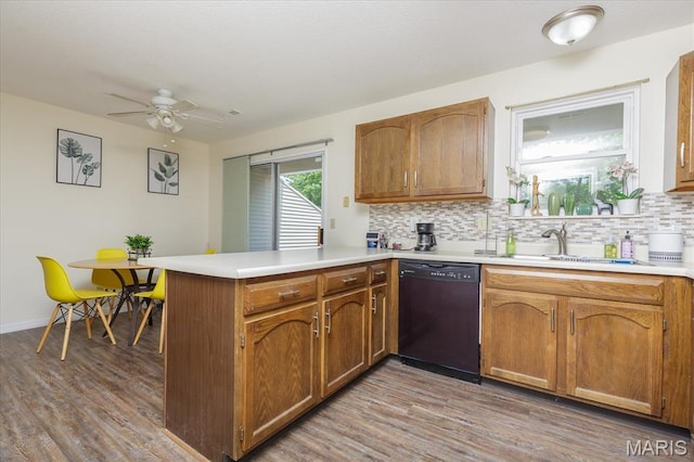 23 Trailside Ct Unit 2, Saint Peters, MO 63303 - kitchen with dishwasher, a peninsula, decorative backsplash, light countertops, and light wood-style flooring