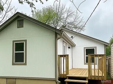 1412 N Olive St, Mexico, MO 65265 - view of property exterior with a wooden deck