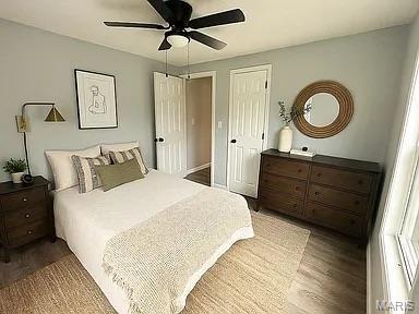 1412 N Olive St, Mexico, MO 65265 - bedroom with wood finished floors and ceiling fan