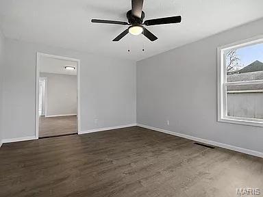 1412 N Olive St, Mexico, MO 65265 - unfurnished room featuring wood finished floors and ceiling fan