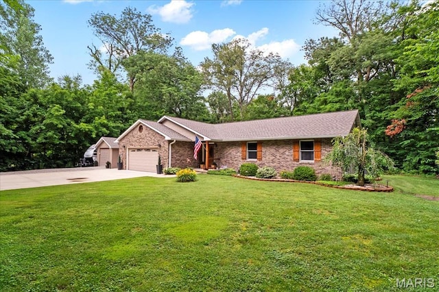 13345 Iberg Rd, Highland, IL 62249 - ranch-style home with a garage, concrete driveway, a front yard, and brick siding