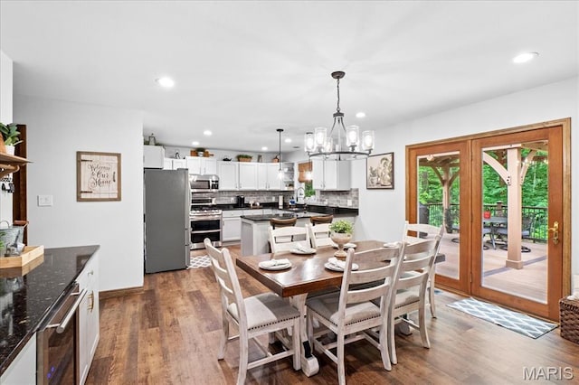 13345 Iberg Rd, Highland, IL 62249 - dining room featuring wood finished floors, a chandelier, and recessed lighting