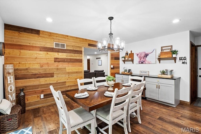 13345 Iberg Rd, Highland, IL 62249 - dining space featuring wooden walls, a chandelier, dark wood-style flooring, and recessed lighting