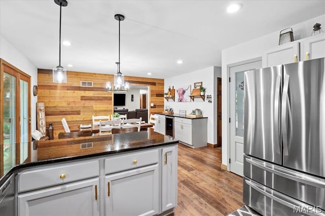 13345 Iberg Rd, Highland, IL 62249 - kitchen with freestanding refrigerator, beverage cooler, recessed lighting, light wood-style flooring, and decorative light fixtures