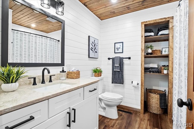 13345 Iberg Rd, Highland, IL 62249 - full bathroom featuring wooden ceiling, wood finished floors, vanity, and wood walls