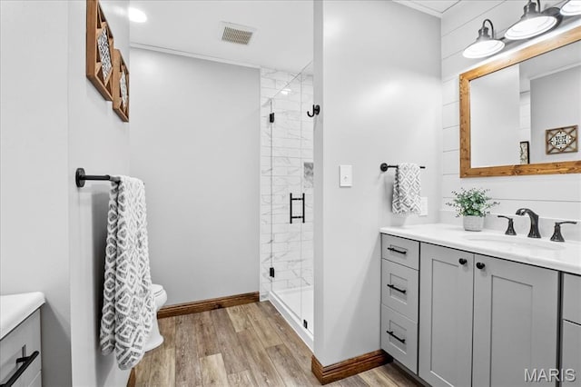 13345 Iberg Rd, Highland, IL 62249 - full bathroom with vanity, wood finished floors, and a shower stall