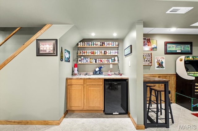 13345 Iberg Rd, Highland, IL 62249 - indoor wet bar featuring recessed lighting, light tile patterned floors, and fridge