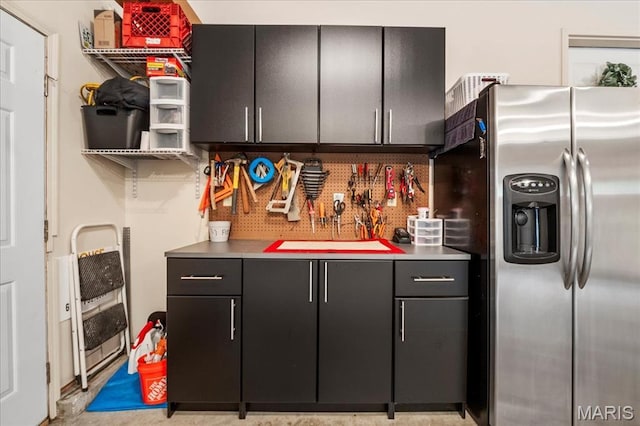 13345 Iberg Rd, Highland, IL 62249 - kitchen with stainless steel fridge with ice dispenser, dark cabinets, and light countertops