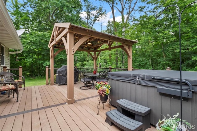 13345 Iberg Rd, Highland, IL 62249 - wooden terrace with a hot tub, area for grilling, a gazebo, and outdoor dining space