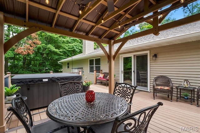 13345 Iberg Rd, Highland, IL 62249 - wooden terrace featuring a hot tub and outdoor dining area