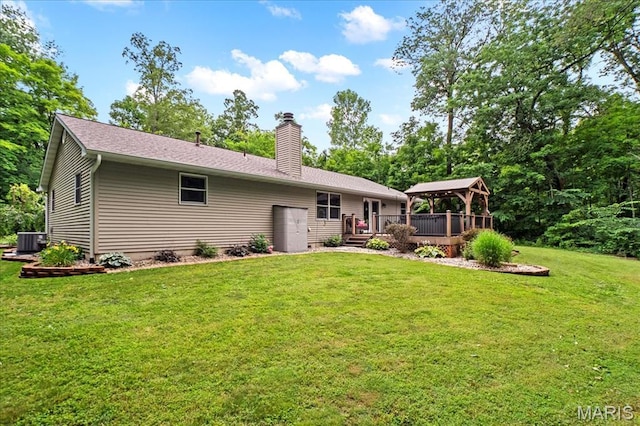 13345 Iberg Rd, Highland, IL 62249 - back of property featuring a gazebo, a chimney, a deck, and a yard