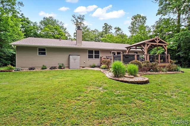 13345 Iberg Rd, Highland, IL 62249 - rear view of property featuring a gazebo, a chimney, and a lawn