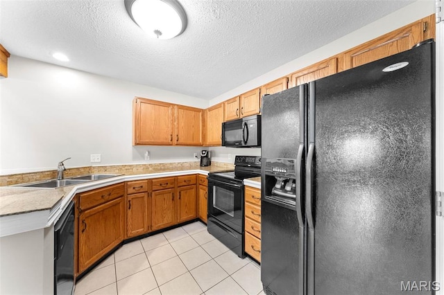 856 Hemingway Ln Unit D, Weldon Spring, MO 63304 - kitchen featuring black appliances, light tile patterned floors, light countertops, a textured ceiling, and brown cabinets