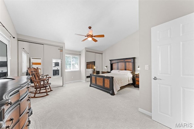 856 Hemingway Ln Unit D, Weldon Spring, MO 63304 - bedroom featuring light colored carpet, vaulted ceiling, a ceiling fan, and multiple closets