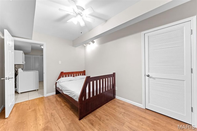 856 Hemingway Ln Unit D, Weldon Spring, MO 63304 - bedroom featuring washer / dryer, light wood finished floors, and ceiling fan