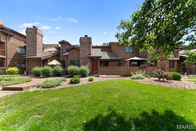 856 Hemingway Ln Unit D, Weldon Spring, MO 63304 - back of house featuring a yard and a chimney