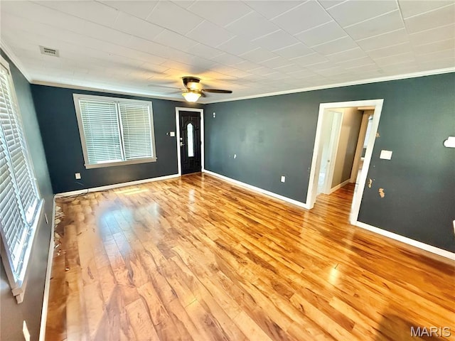 904 Vernon St, Farmington, MO 63640 - spare room with crown molding, hardwood / wood-style floors, healthy amount of natural light, and a ceiling fan