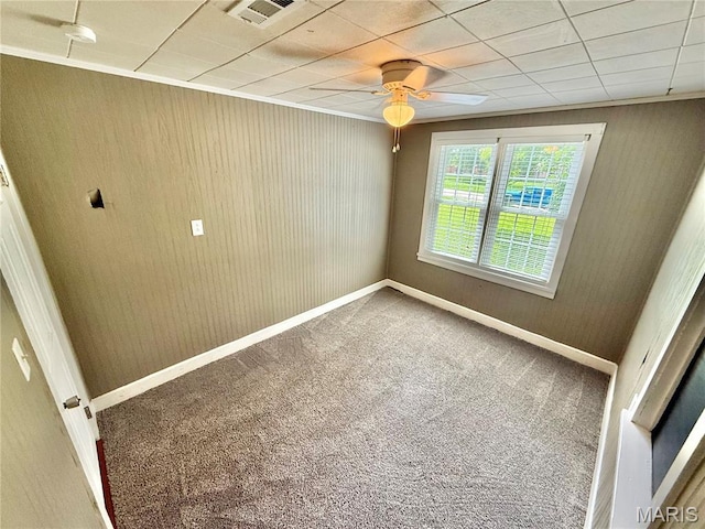 904 Vernon St, Farmington, MO 63640 - unfurnished room with carpet floors, ceiling fan, a smoke detector, and wooden walls