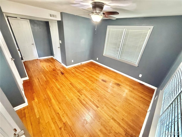 904 Vernon St, Farmington, MO 63640 - spare room with a ceiling fan and hardwood / wood-style floors