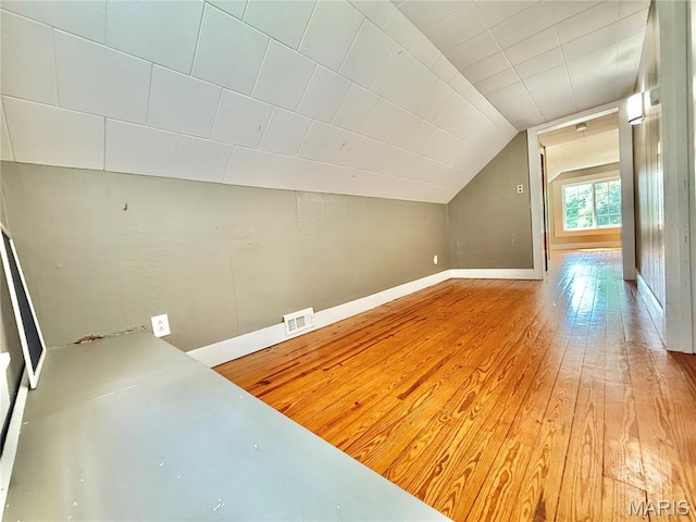 904 Vernon St, Farmington, MO 63640 - additional living space with lofted ceiling and hardwood / wood-style flooring