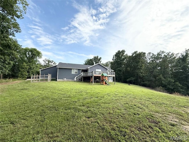 22115 Royce Ln, Waynesville, MO 65583 - back of house with stairway, a wooden deck, and a yard