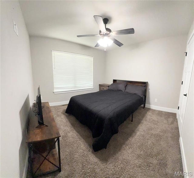 22115 Royce Ln, Waynesville, MO 65583 - carpeted bedroom with baseboards and ceiling fan