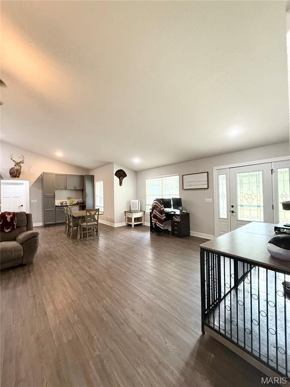 22115 Royce Ln, Waynesville, MO 65583 - living area featuring dark wood-type flooring and lofted ceiling