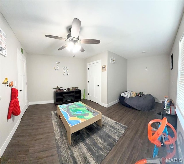 22115 Royce Ln, Waynesville, MO 65583 - recreation room with dark wood-style flooring, ceiling fan, and healthy amount of natural light
