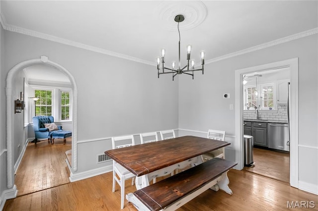 1000 Diversey Dr, Crestwood, MO 63126 - dining room featuring hardwood / wood-style floors, a chandelier, and ornamental molding