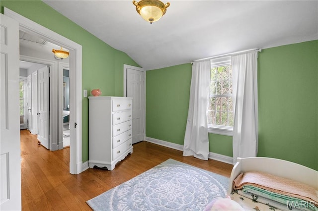 1000 Diversey Dr, Crestwood, MO 63126 - bedroom with wood finished floors and vaulted ceiling