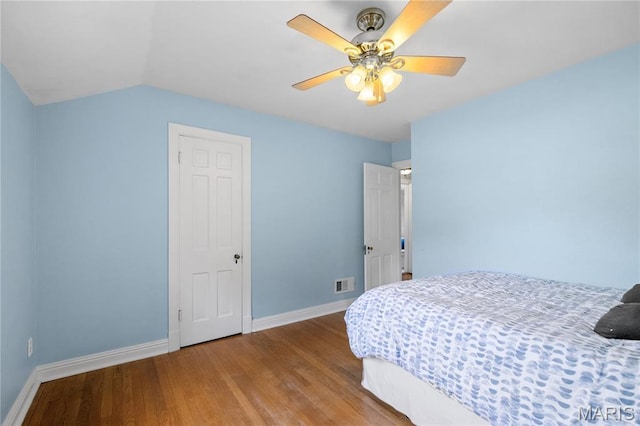 1000 Diversey Dr, Crestwood, MO 63126 - bedroom featuring wood finished floors, ceiling fan, and vaulted ceiling