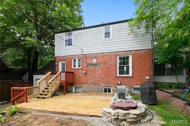 1000 Diversey Dr, Crestwood, MO 63126 - rear view of property featuring brick siding, a deck, and a fire pit