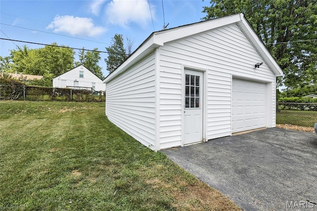 9441 Ridge Ave, Overland, MO 63114 - detached garage featuring asphalt driveway