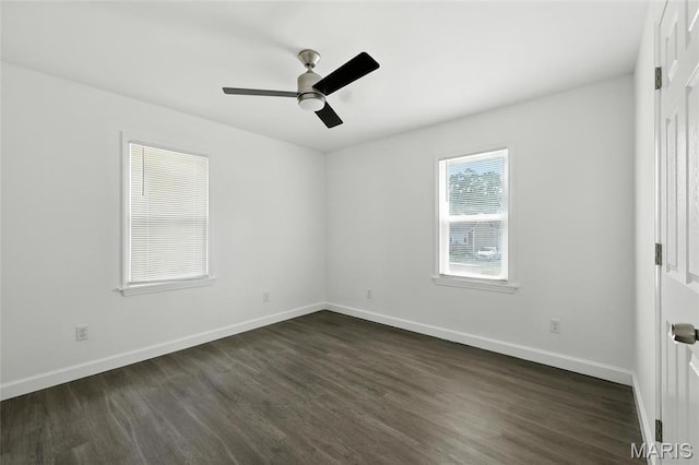 9441 Ridge Ave, Overland, MO 63114 - spare room featuring dark wood-style floors and ceiling fan