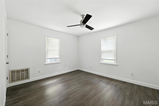 9441 Ridge Ave, Overland, MO 63114 - unfurnished room featuring dark wood-style floors and ceiling fan