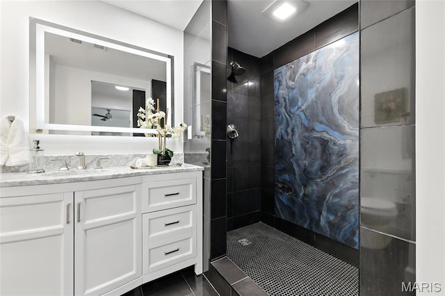 9441 Ridge Ave, Overland, MO 63114 - bathroom with vanity, walk in shower, ceiling fan, and tile patterned flooring