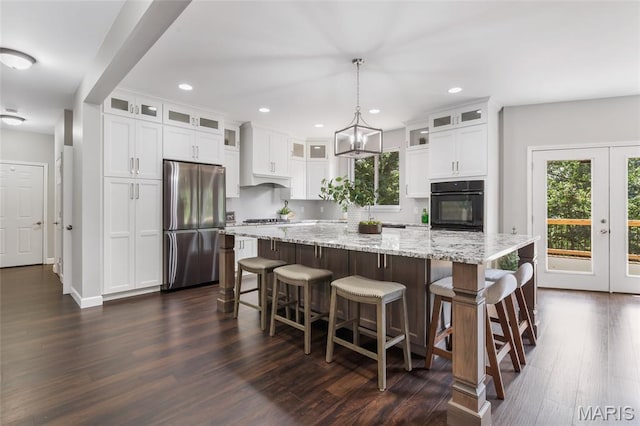 3516 Hawthorne Ridge Dr, Eureka, MO 63025 - kitchen with stainless steel appliances, healthy amount of natural light, dark wood-style floors, a large island, and recessed lighting