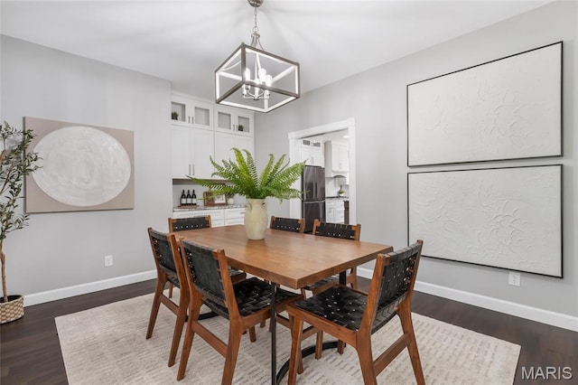3516 Hawthorne Ridge Dr, Eureka, MO 63025 - dining room featuring a chandelier and dark wood-style flooring
