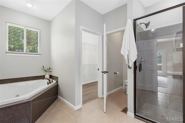3516 Hawthorne Ridge Dr, Eureka, MO 63025 - bathroom featuring a stall shower, a tub with jets, and tile patterned flooring
