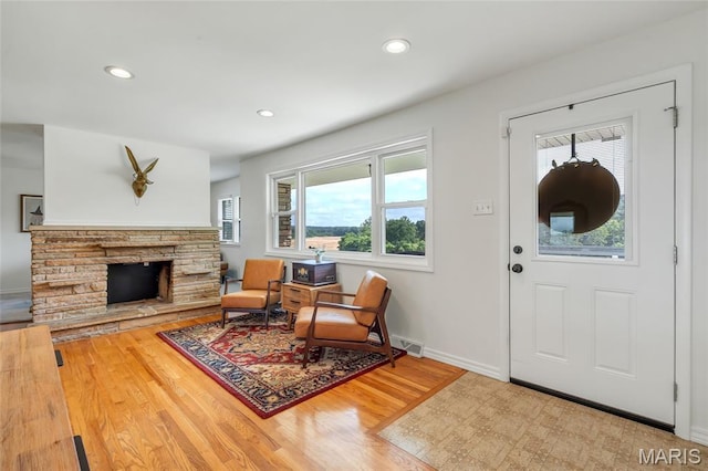 5701 State Road P, De Soto, MO 63020 - foyer with wood finished floors, recessed lighting, and a fireplace