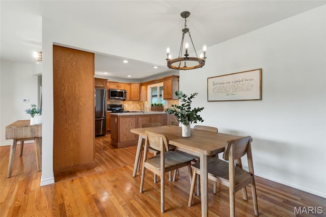 5701 State Road P, De Soto, MO 63020 - dining space featuring a chandelier, light wood-style floors, and recessed lighting