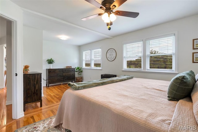 5701 State Road P, De Soto, MO 63020 - bedroom featuring multiple windows, light wood-type flooring, and ceiling fan