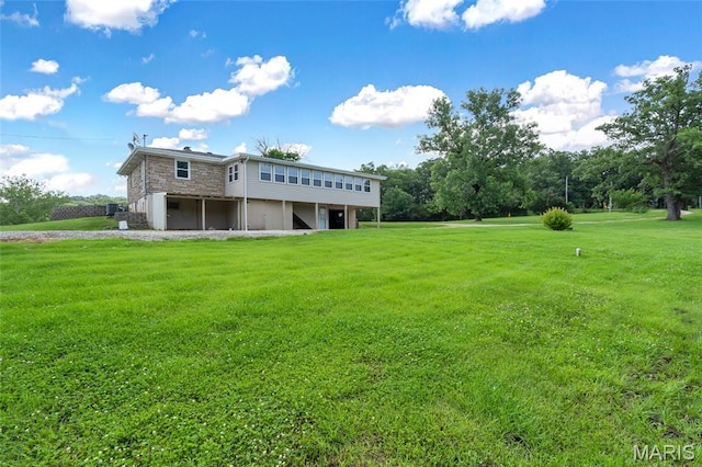 5701 State Road P, De Soto, MO 63020 - rear view of house featuring a yard, stone siding, and a deck