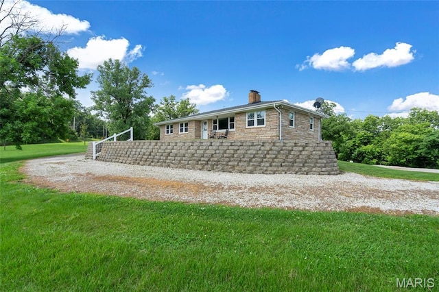 5701 State Road P, De Soto, MO 63020 - view of front of home featuring a chimney, a front lawn, and stone siding