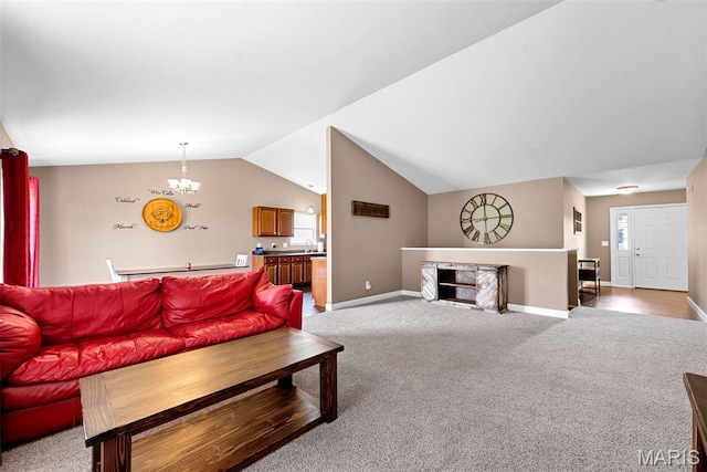 107 Piety Dr, Lake St Louis, MO 63367 - carpeted living room featuring lofted ceiling and a chandelier