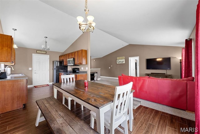 107 Piety Dr, Lake St Louis, MO 63367 - dining room featuring a chandelier, vaulted ceiling, and dark wood finished floors