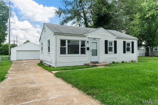 4539 Ashby Rd, Saint Ann, MO 63074 - view of front facade with an outdoor structure, a detached garage, and roof with shingles