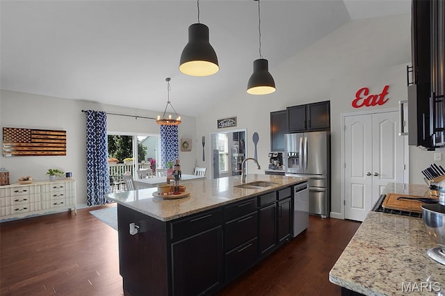 234 Lonepine Dr, Wentzville, MO 63385 - kitchen featuring stainless steel appliances, dark wood-type flooring, light stone countertops, an island with sink, and high vaulted ceiling
