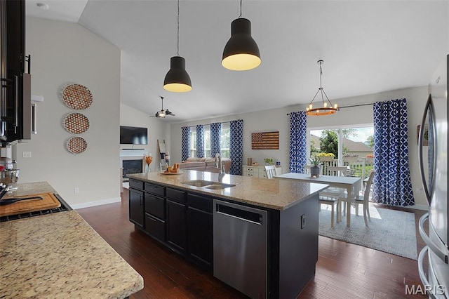 234 Lonepine Dr, Wentzville, MO 63385 - kitchen with stainless steel dishwasher, open floor plan, a chandelier, lofted ceiling, and dark cabinets